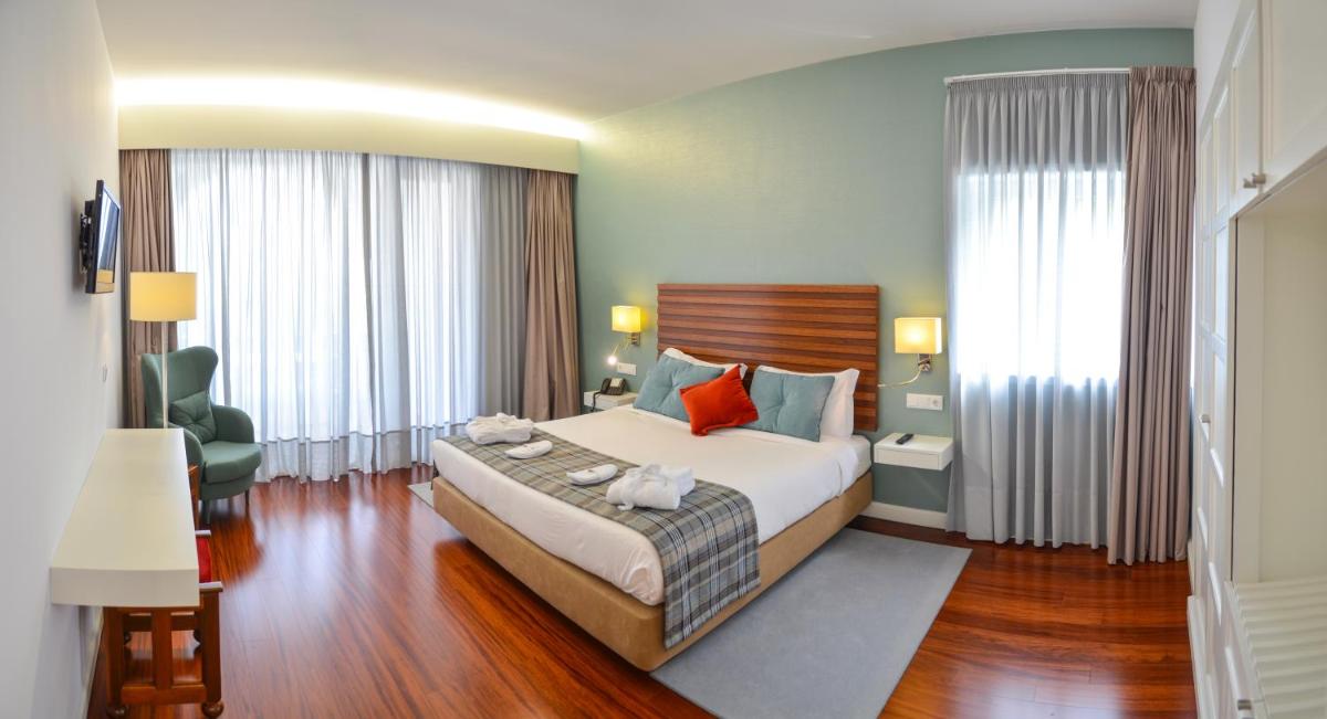Uma cama ou camas num quarto em Hotel São Bento da Porta Aberta & Spa