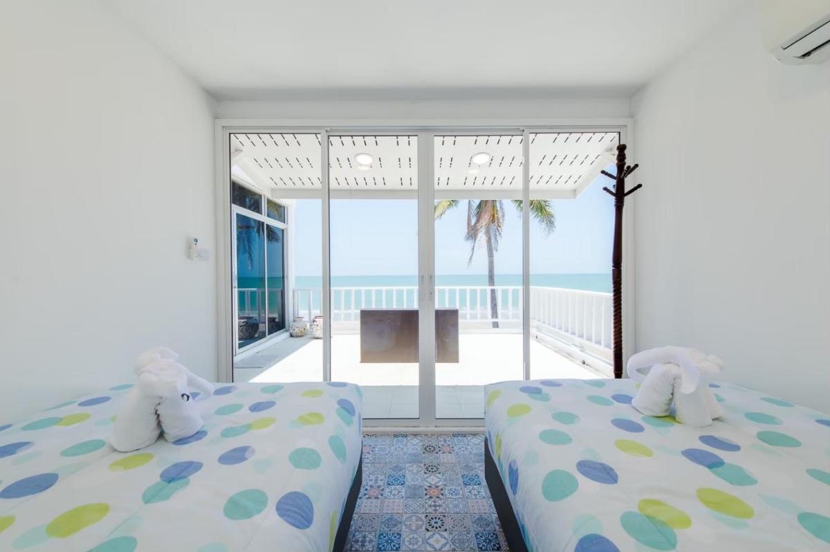 TheSkyCozy Beachfront - Housity