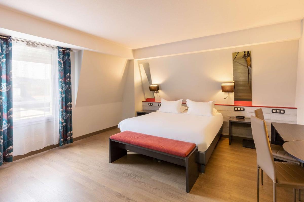 Un ou plusieurs lits dans un hébergement de l'établissement Best Western Hotel & SPA Pau Lescar Aeroport