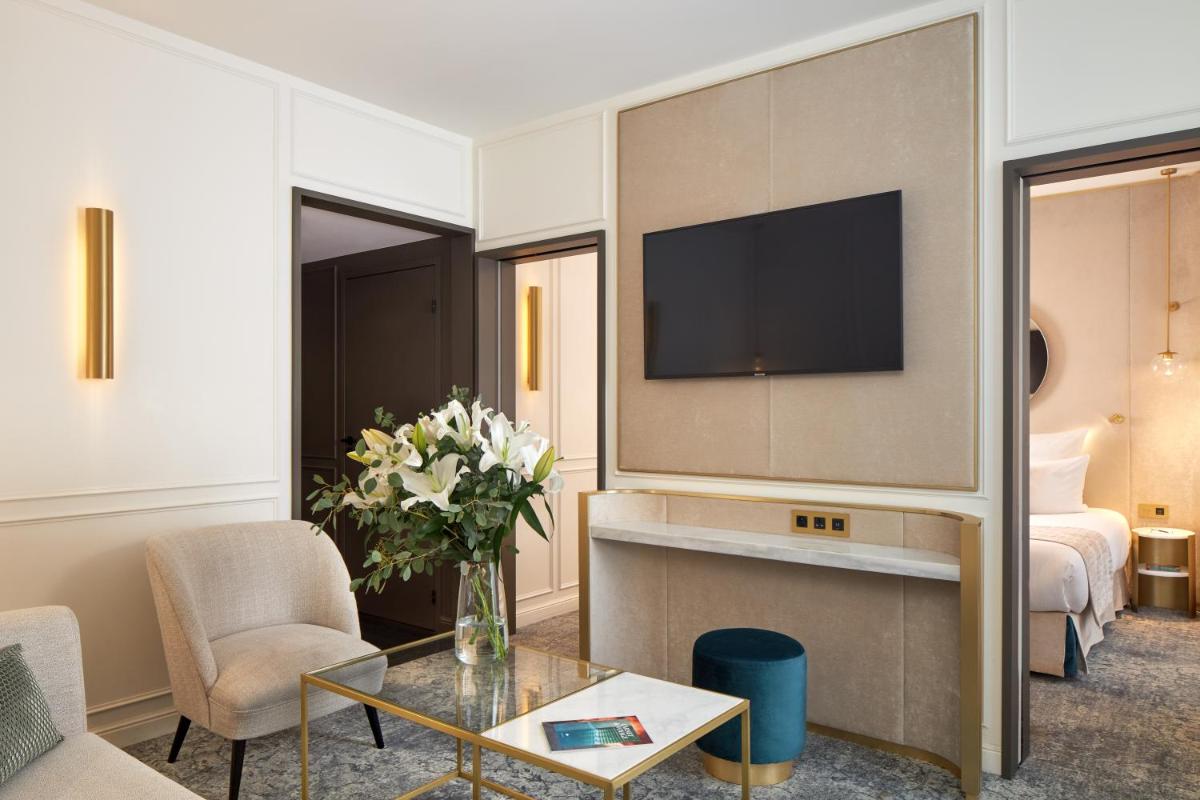 Télévision ou salle de divertissement dans l'établissement Maison Albar - Le Vendome