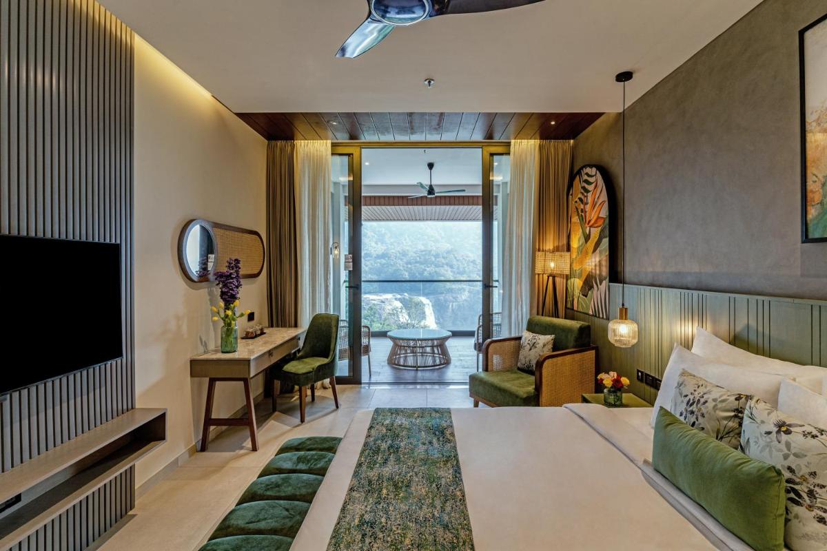 Flora Misty Falls Athirappilly - Housity