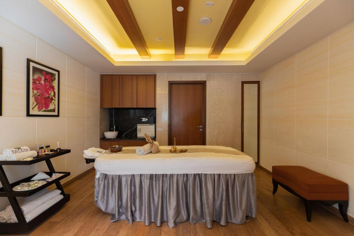 a bedroom with a large bed in a room at InterContinental Jaipur Tonk Road by IHG in Jaipur