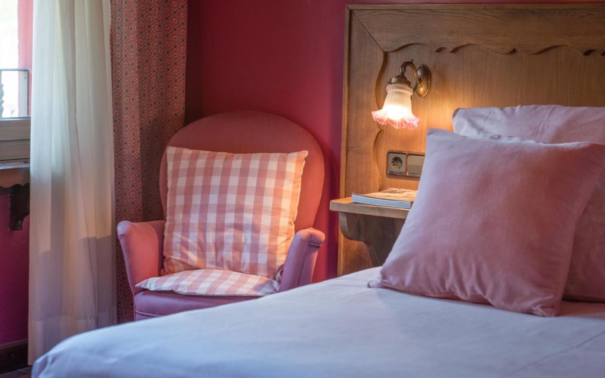 Cama o camas de una habitación en Hotel Aran La Abuela