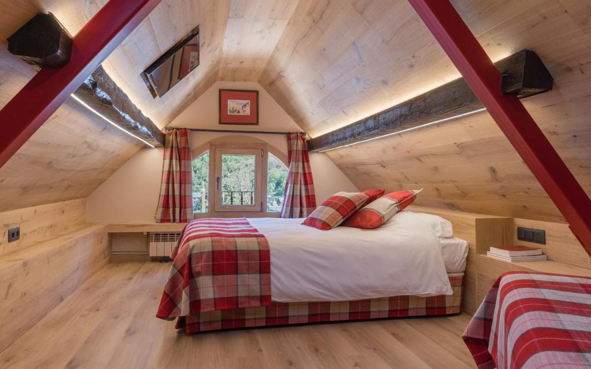 Cama o camas de una habitación en Hotel Aran La Abuela