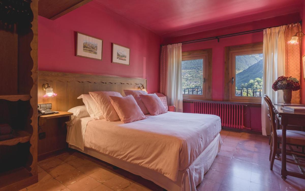 Cama o camas de una habitación en Hotel Aran La Abuela