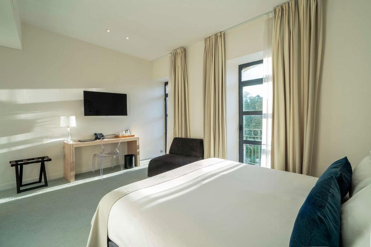 Télévision ou salle de divertissement dans l'établissement Best Western Plus Villa Saint Antoine Hotel & Spa