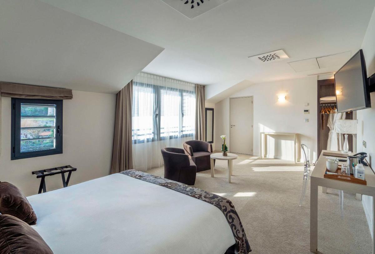Télévision ou salle de divertissement dans l'établissement Best Western Plus Villa Saint Antoine Hotel & Spa