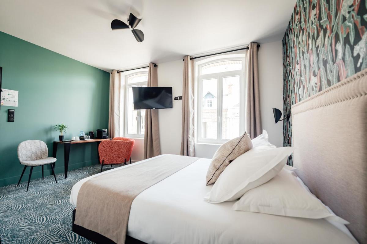 Un ou plusieurs lits dans un hébergement de l'établissement La villa 10 HÔTEL SPA