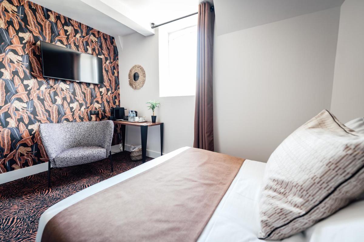 Télévision ou salle de divertissement dans l'établissement La villa 10 HÔTEL SPA