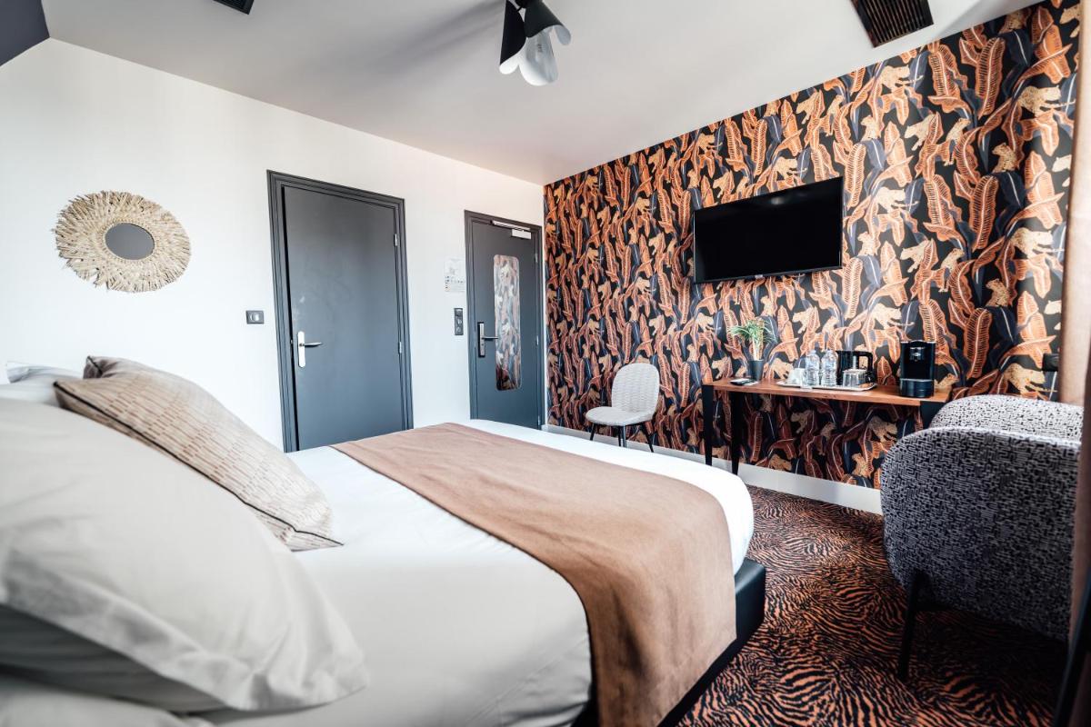 Un ou plusieurs lits dans un hébergement de l'établissement La villa 10 HÔTEL SPA