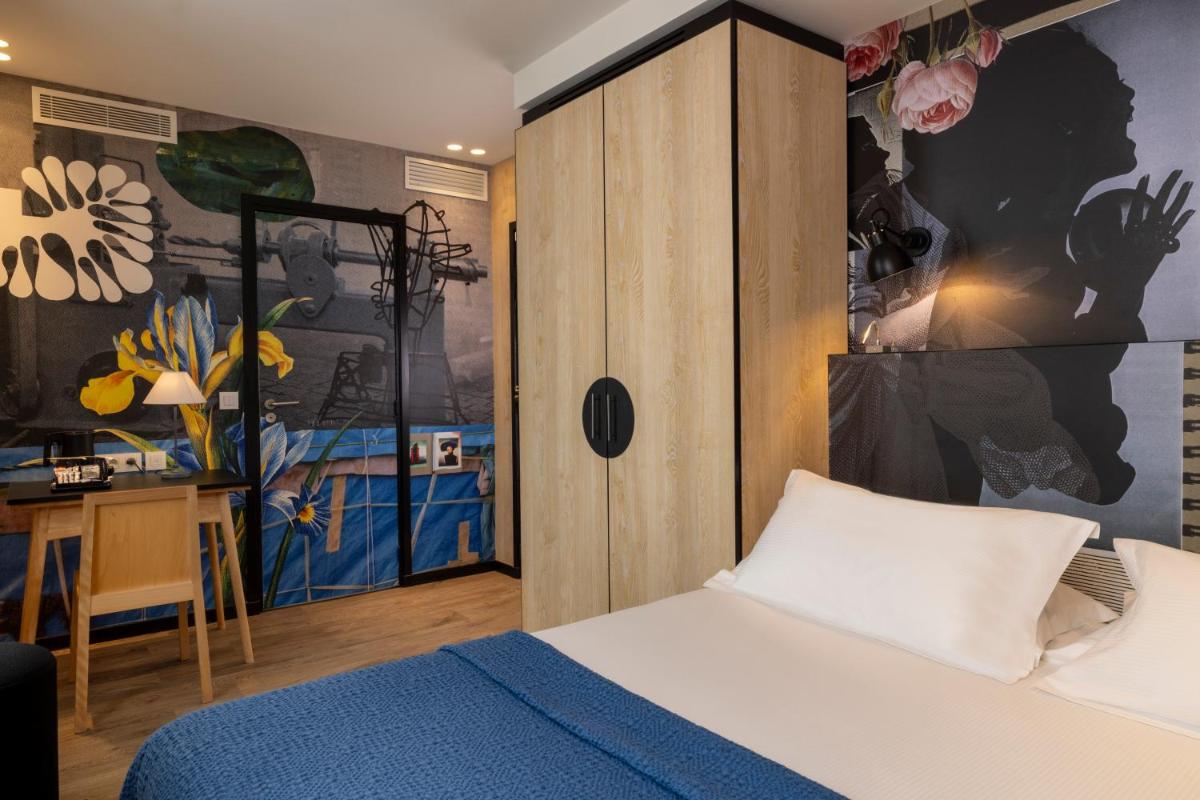 Un ou plusieurs lits dans un hébergement de l'établissement Hotel L’Antoine