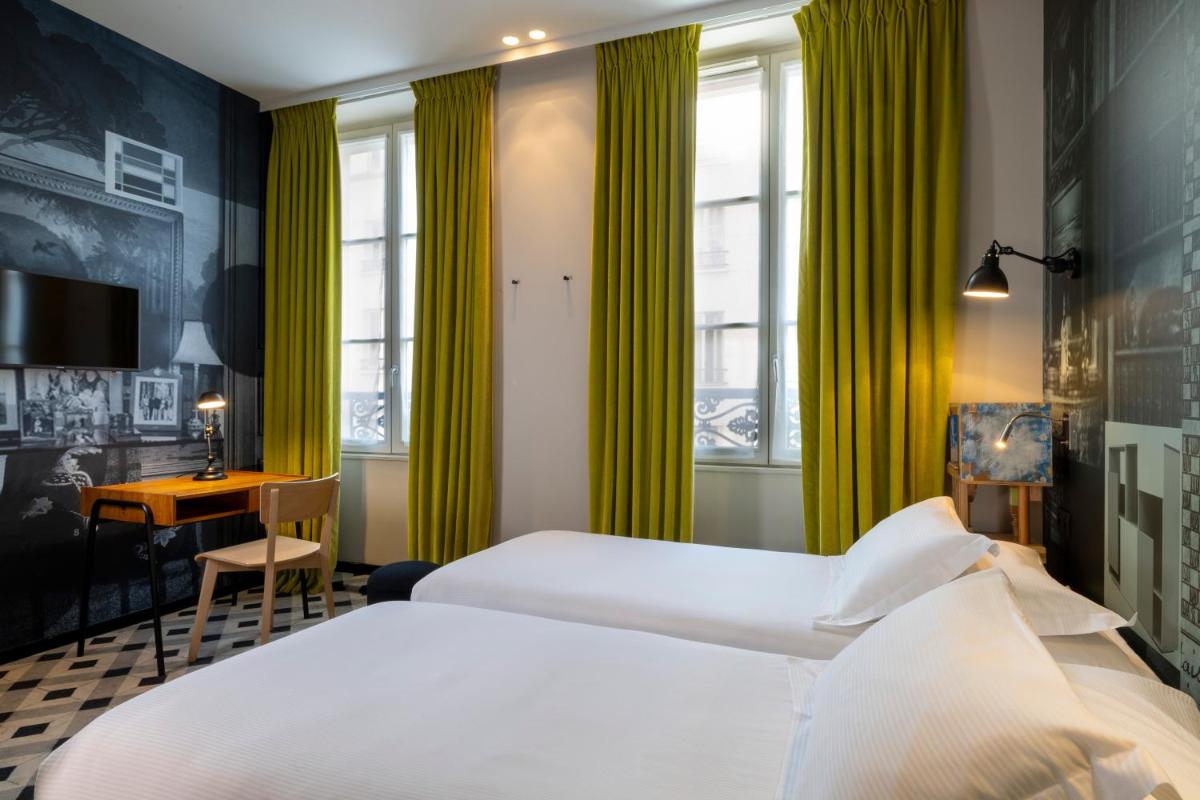 Un ou plusieurs lits dans un hébergement de l'établissement Hotel L’Antoine