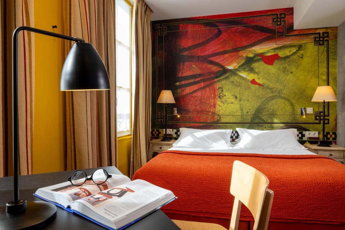 Un ou plusieurs lits dans un hébergement de l'établissement Hotel L’Antoine