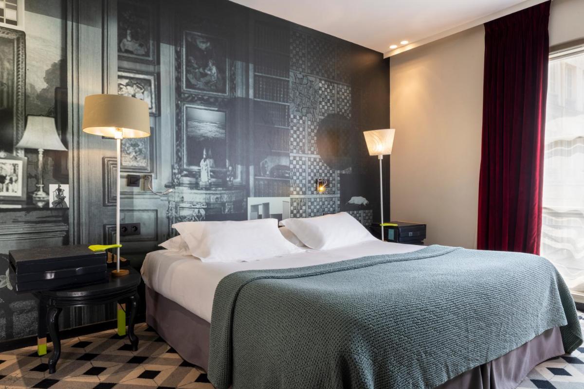 Un ou plusieurs lits dans un hébergement de l'établissement Hotel L’Antoine