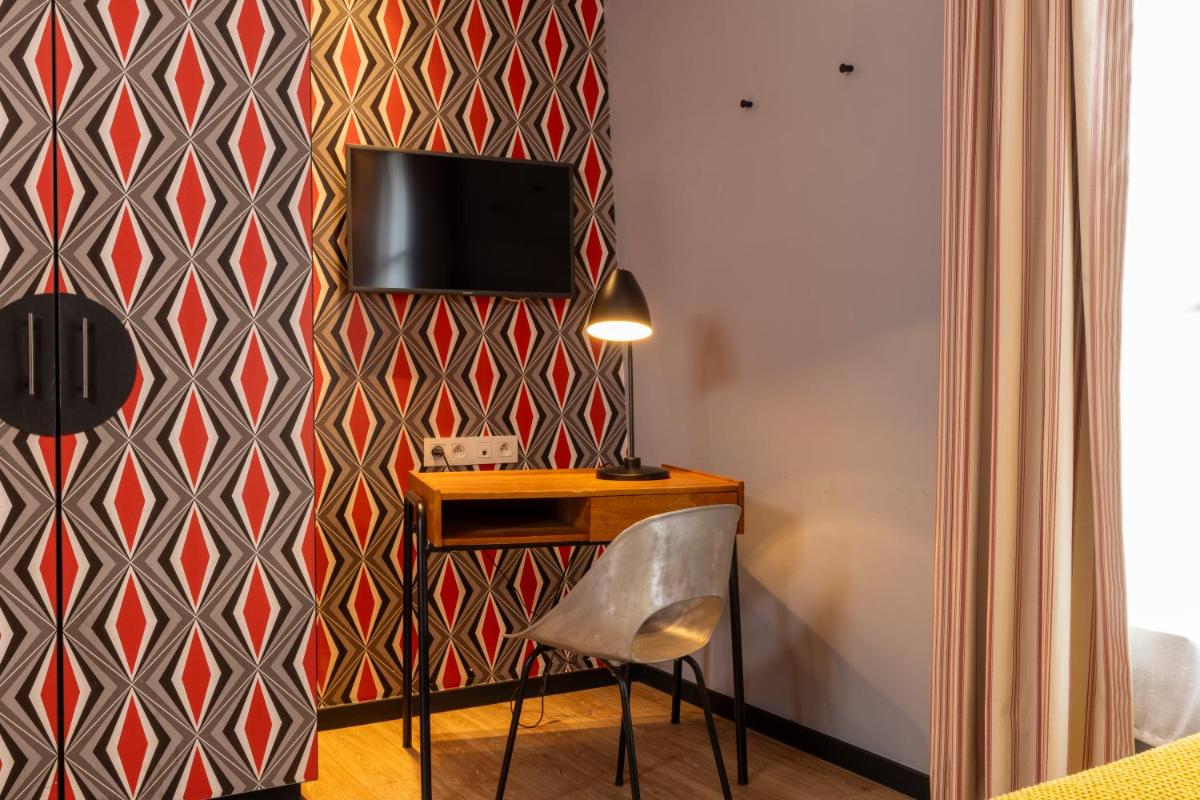 Télévision ou salle de divertissement dans l'établissement Hotel L’Antoine