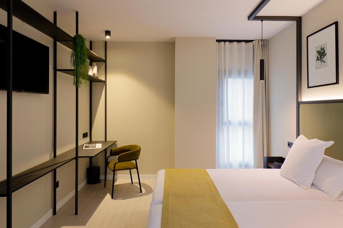 Cama o camas de una habitación en Nuvō Hotel Boutique
