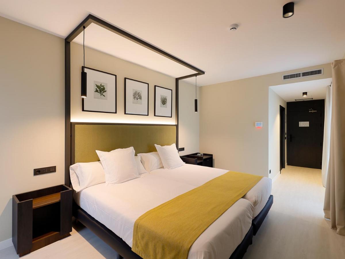 Cama o camas de una habitación en Nuvō Hotel Boutique