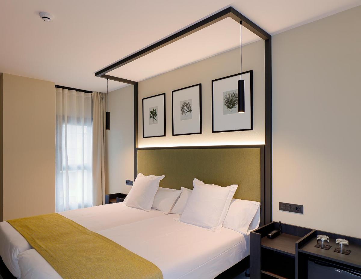 Cama o camas de una habitación en Nuvō Hotel Boutique