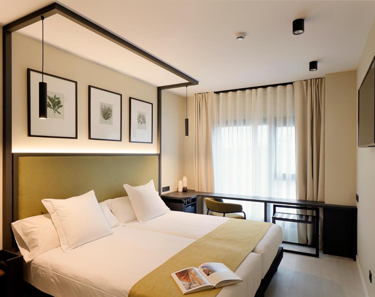 Cama o camas de una habitación en Nuvō Hotel Boutique
