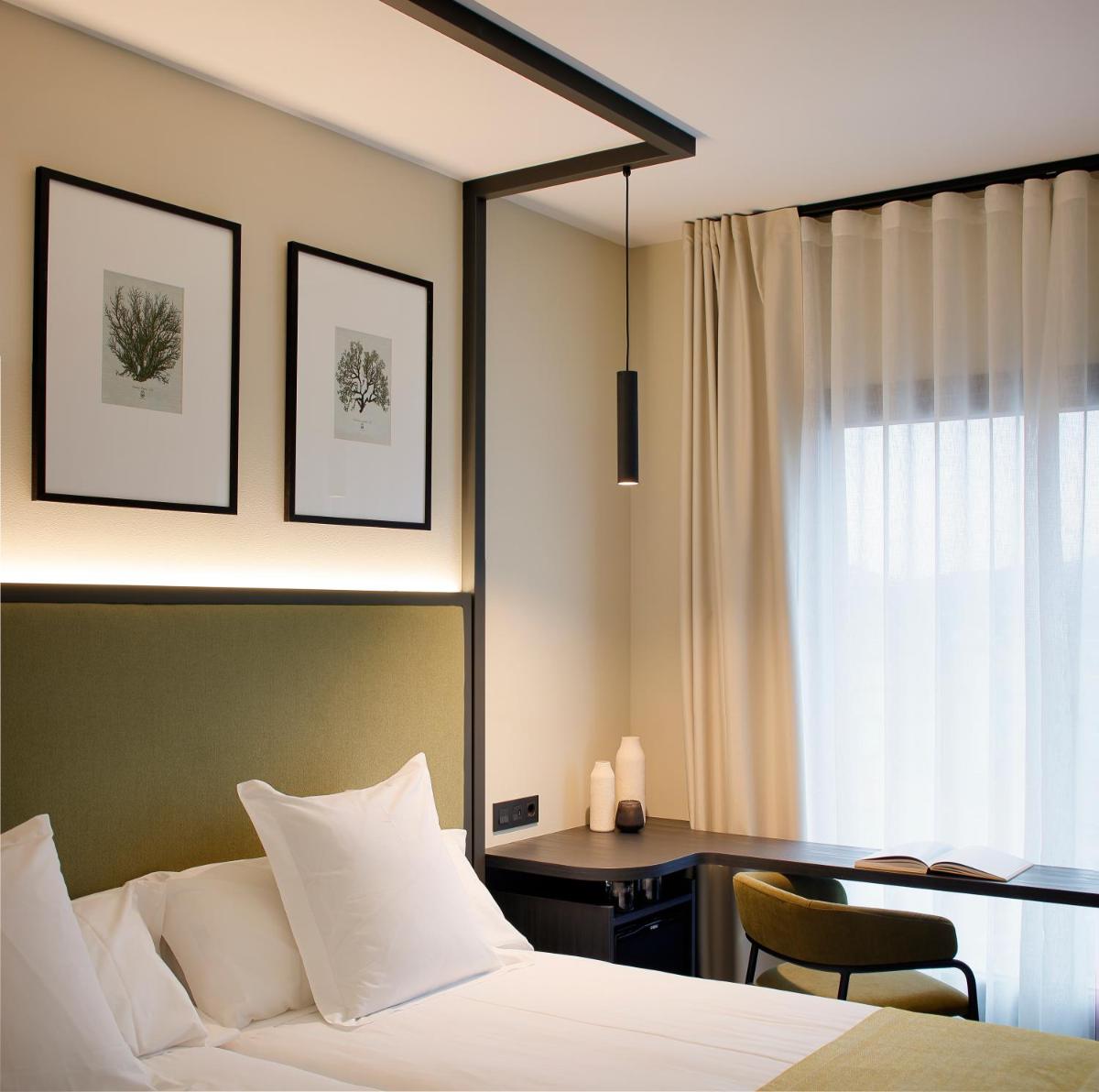 Cama o camas de una habitación en Nuvō Hotel Boutique