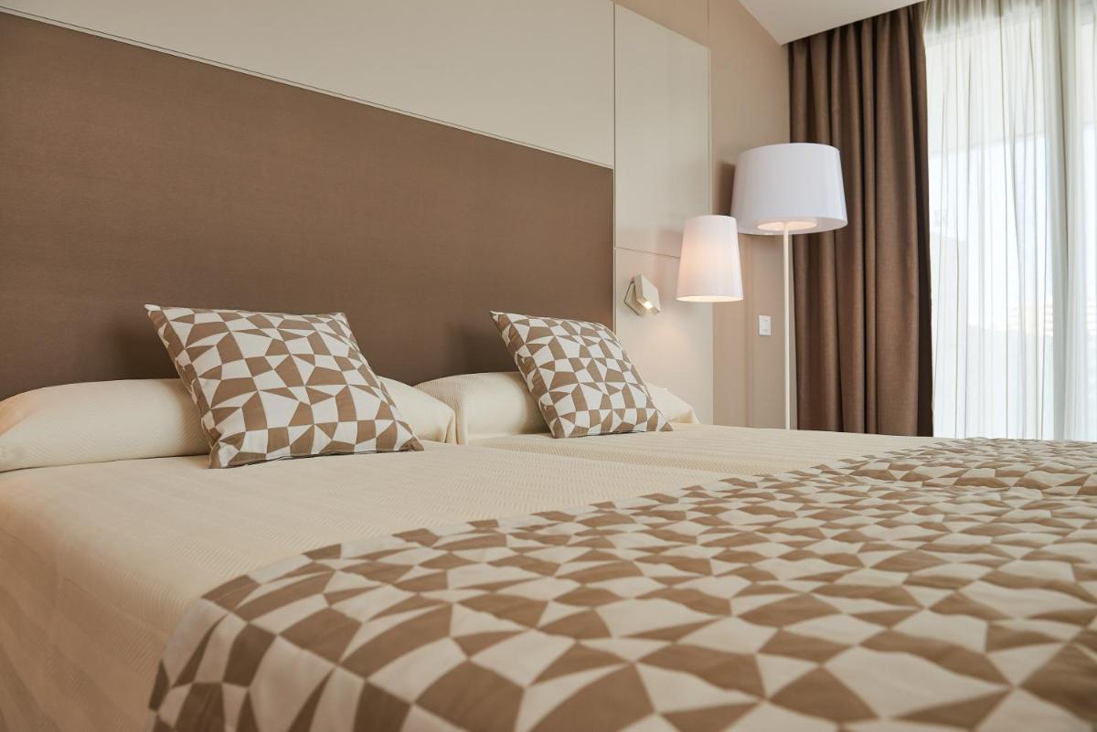 Cama o camas de una habitación en Hipotels Gran Playa de Palma
