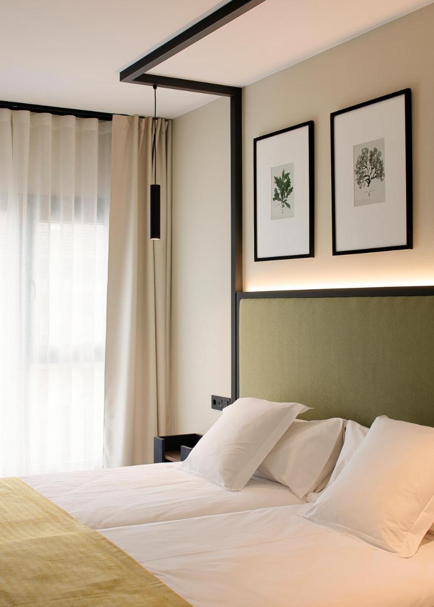Cama o camas de una habitación en Nuvō Hotel Boutique