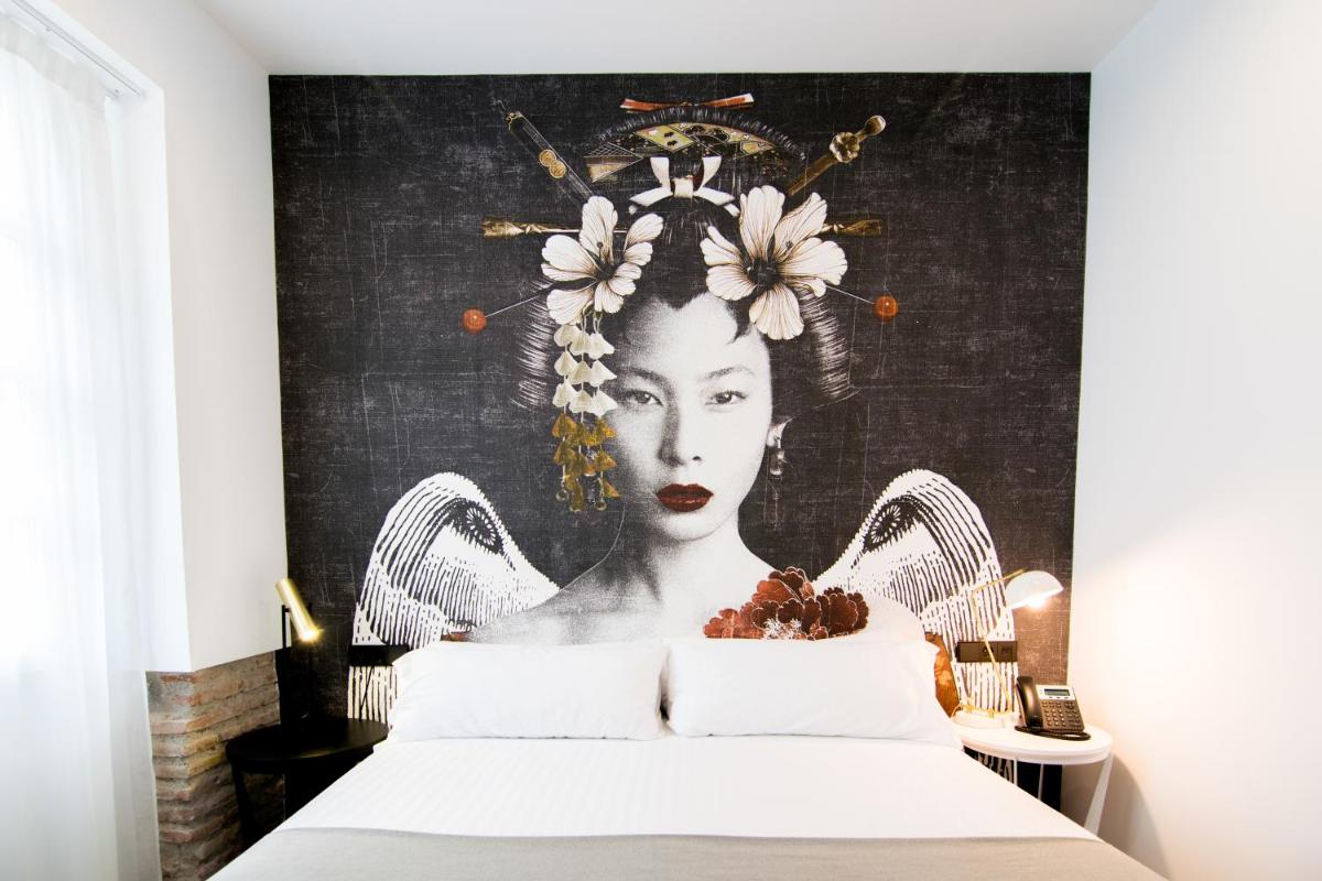 Cama o camas de una habitación en MYR Plaza Mercado & Spa