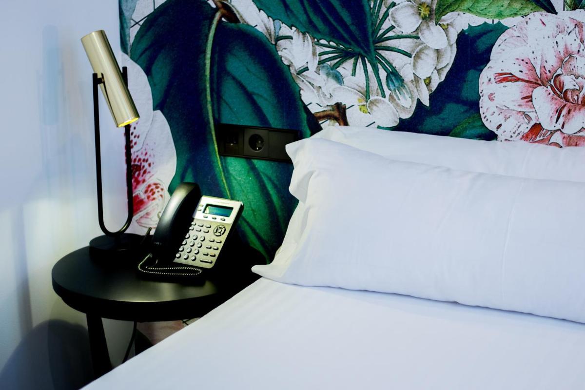 Cama o camas de una habitación en MYR Plaza Mercado & Spa