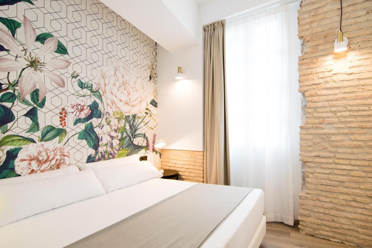 Cama o camas de una habitación en MYR Plaza Mercado & Spa