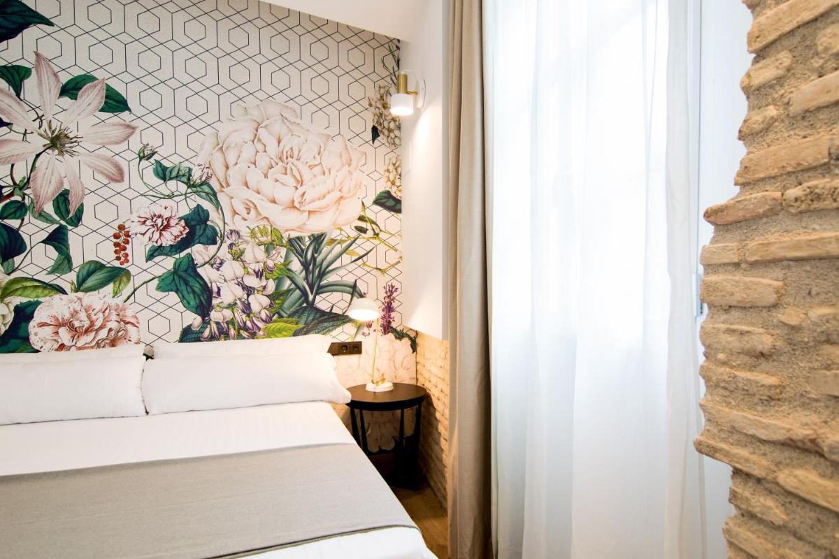 Cama o camas de una habitación en MYR Plaza Mercado & Spa
