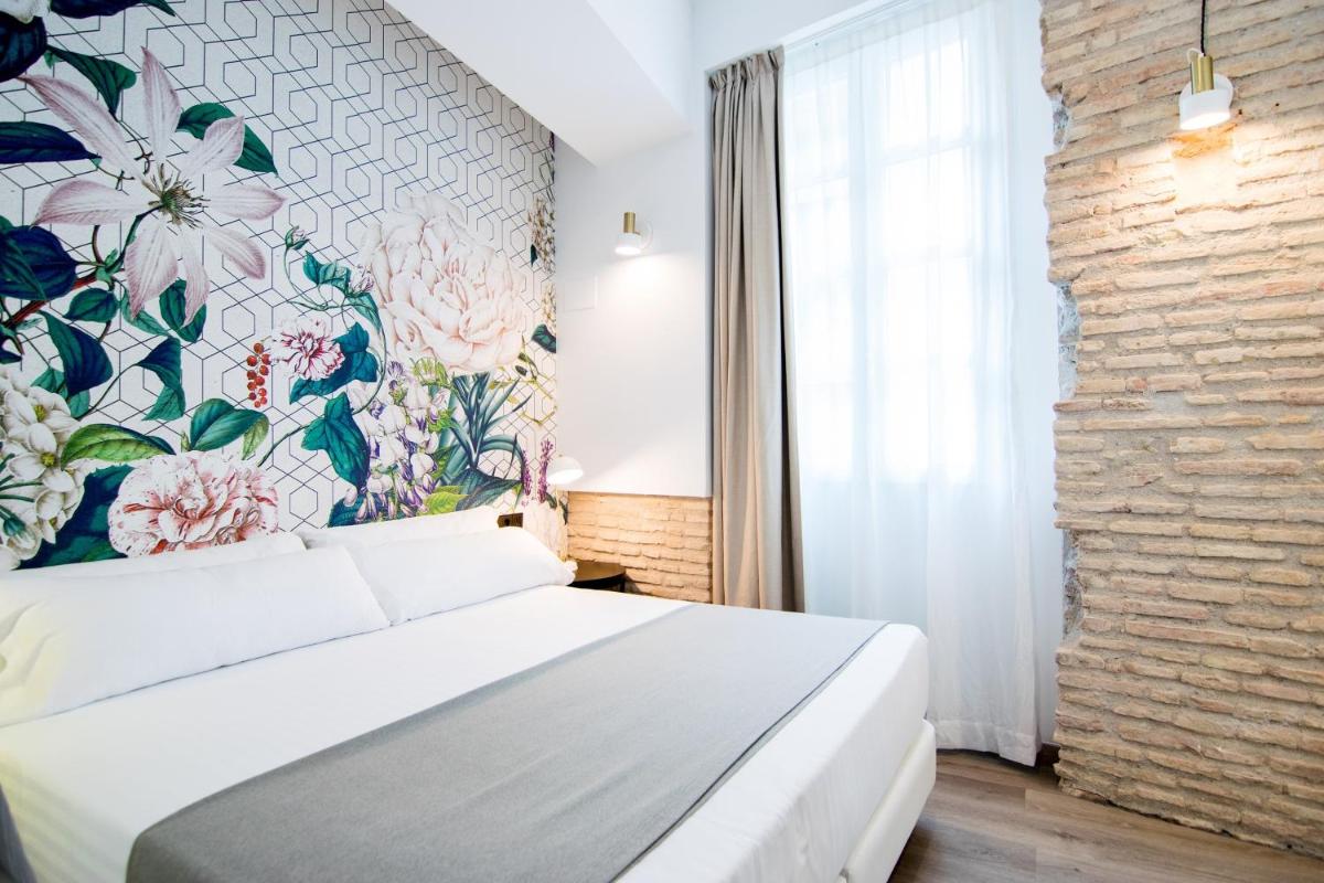 Cama o camas de una habitación en MYR Plaza Mercado & Spa