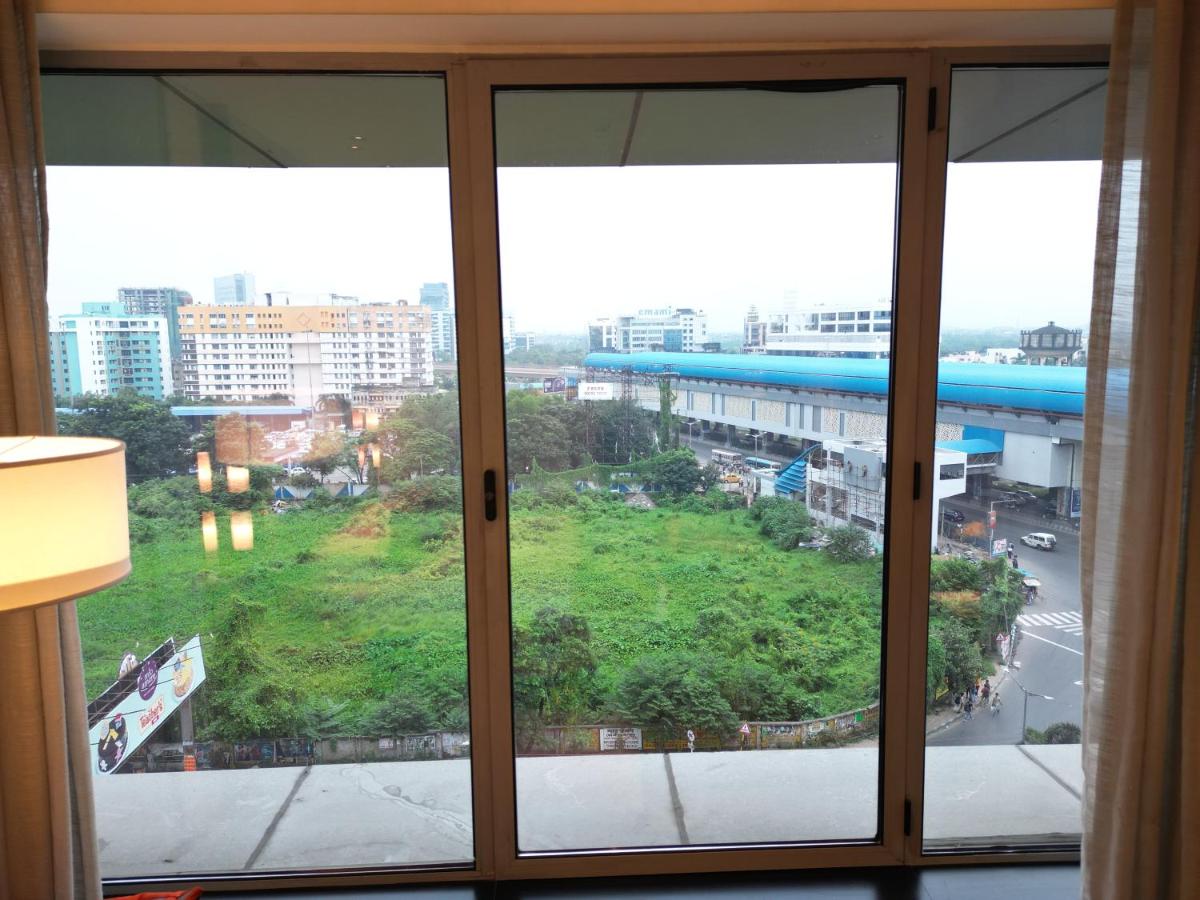 a view of a city from a window at Vivanta Kolkata EM Bypass in Kolkata