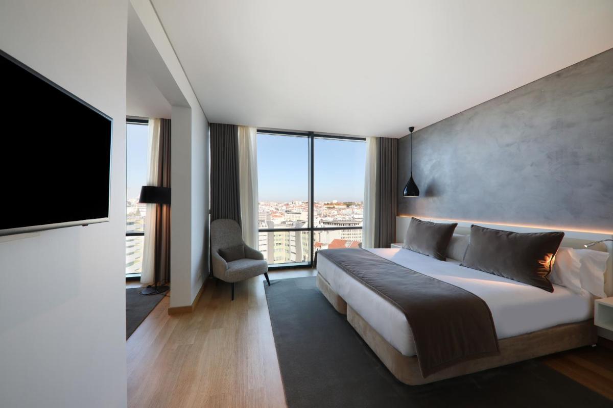Uma cama ou camas num quarto em Iberostar Selection Lisboa
