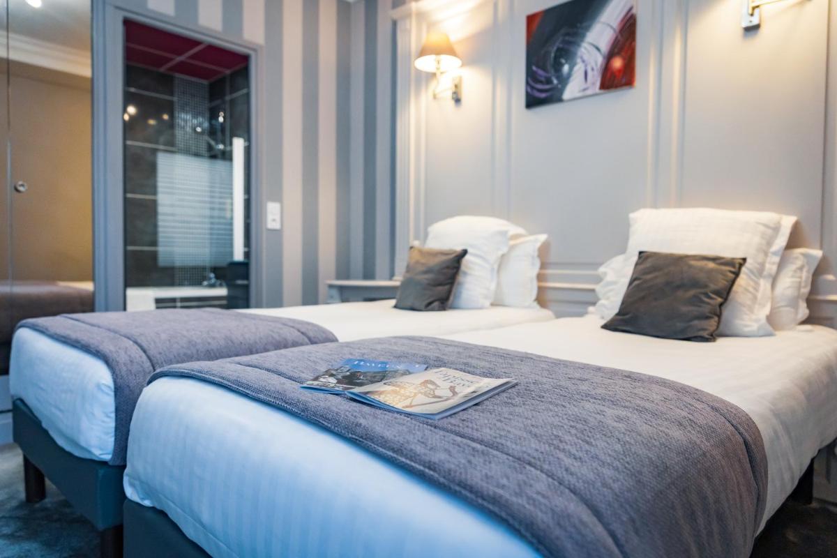 Un ou plusieurs lits dans un hébergement de l'établissement Grand Hôtel du Luxembourg & Spa