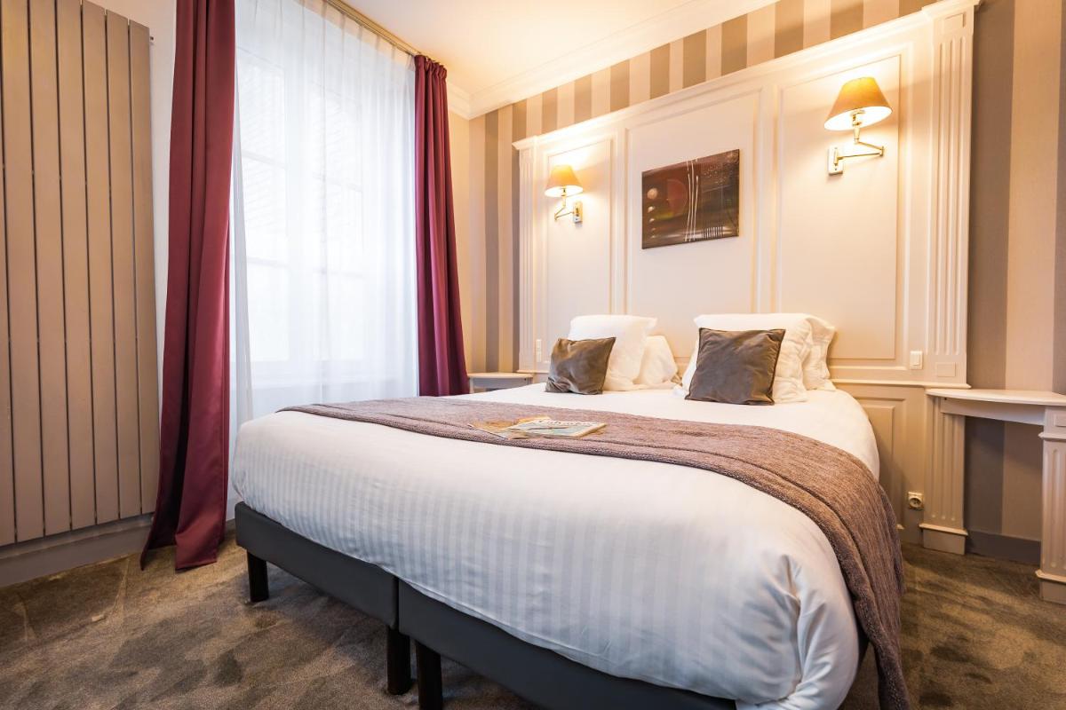 Un ou plusieurs lits dans un hébergement de l'établissement Grand Hôtel du Luxembourg & Spa