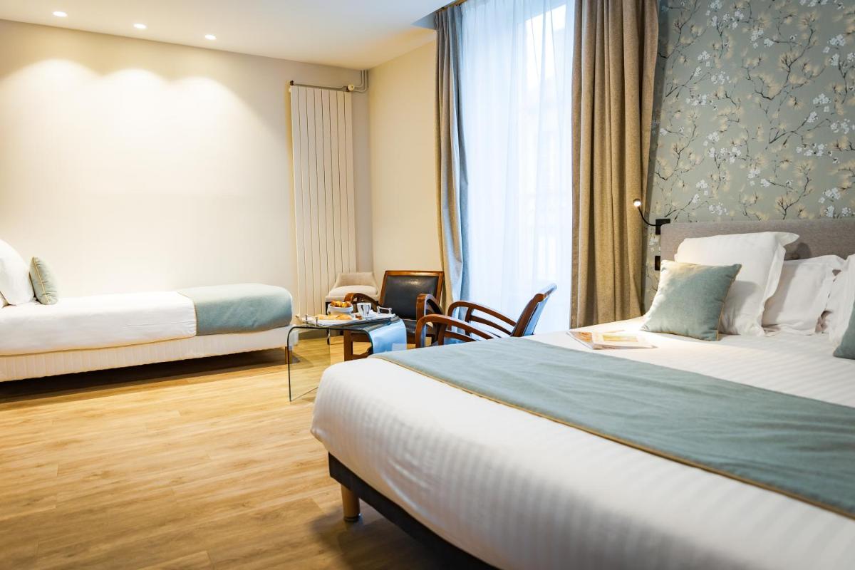 Un ou plusieurs lits dans un hébergement de l'établissement Grand Hôtel du Luxembourg & Spa