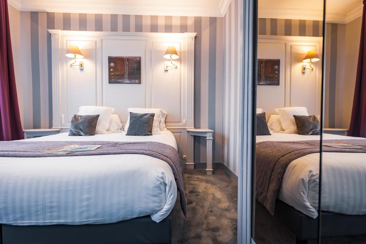 Un ou plusieurs lits dans un hébergement de l'établissement Grand Hôtel du Luxembourg & Spa
