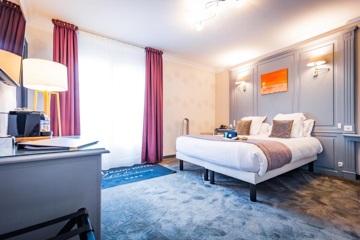 Un ou plusieurs lits dans un hébergement de l'établissement Grand Hôtel du Luxembourg & Spa