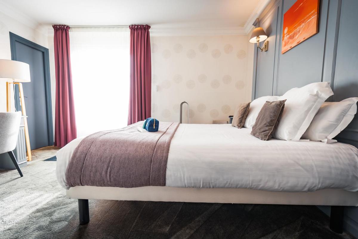 Un ou plusieurs lits dans un hébergement de l'établissement Grand Hôtel du Luxembourg & Spa