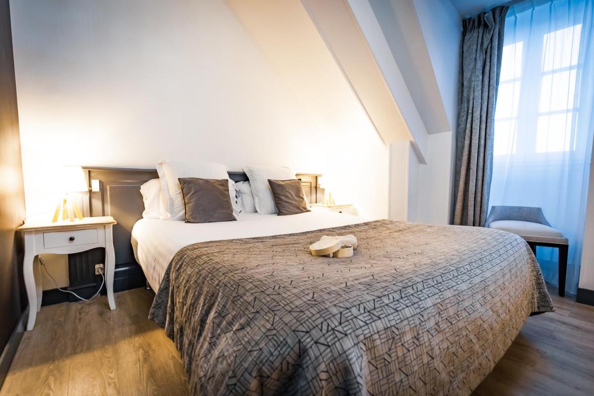 Un ou plusieurs lits dans un hébergement de l'établissement Grand Hôtel du Luxembourg & Spa