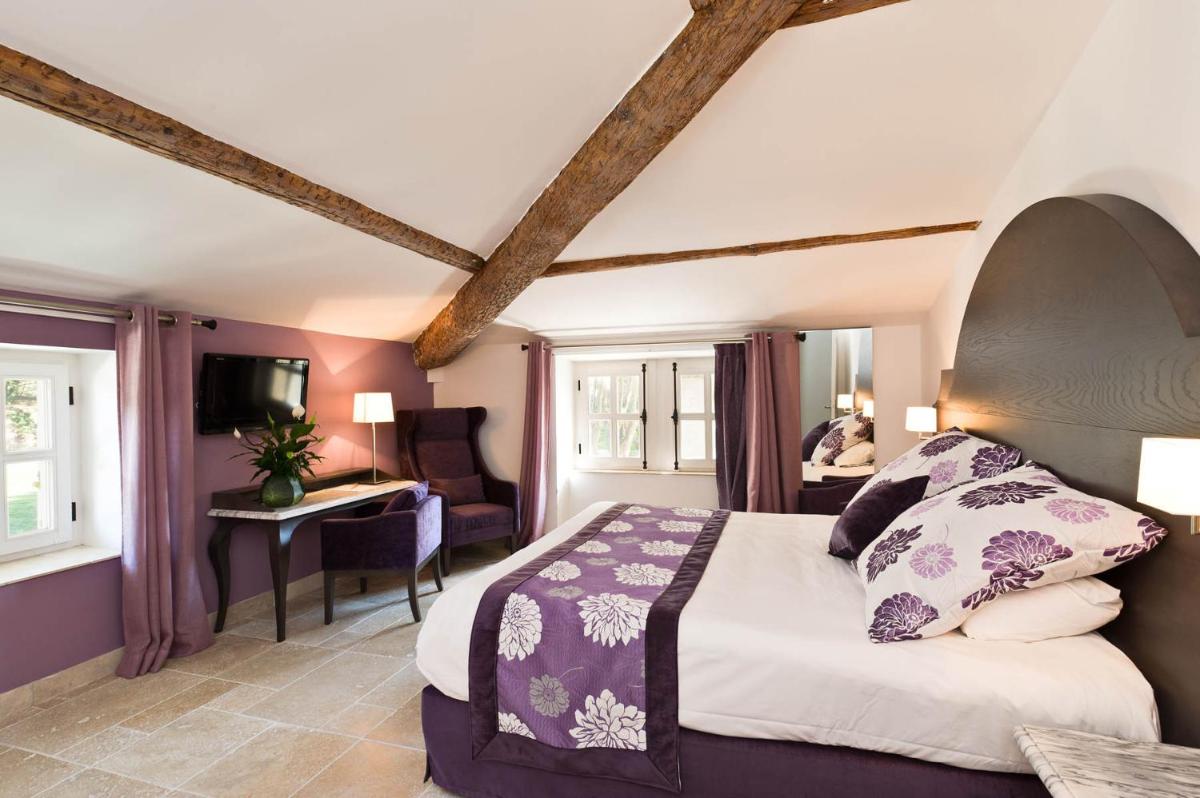 Un ou plusieurs lits dans un hébergement de l'établissement Moulin de Vernègues Hôtel & Spa