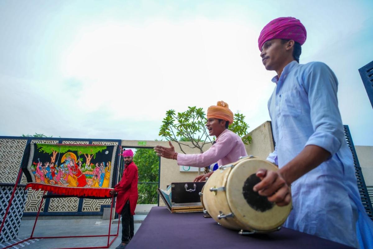 a group of men playing drums on a stage at DoubleTree By Hilton Jaipur Amer in Jaipur