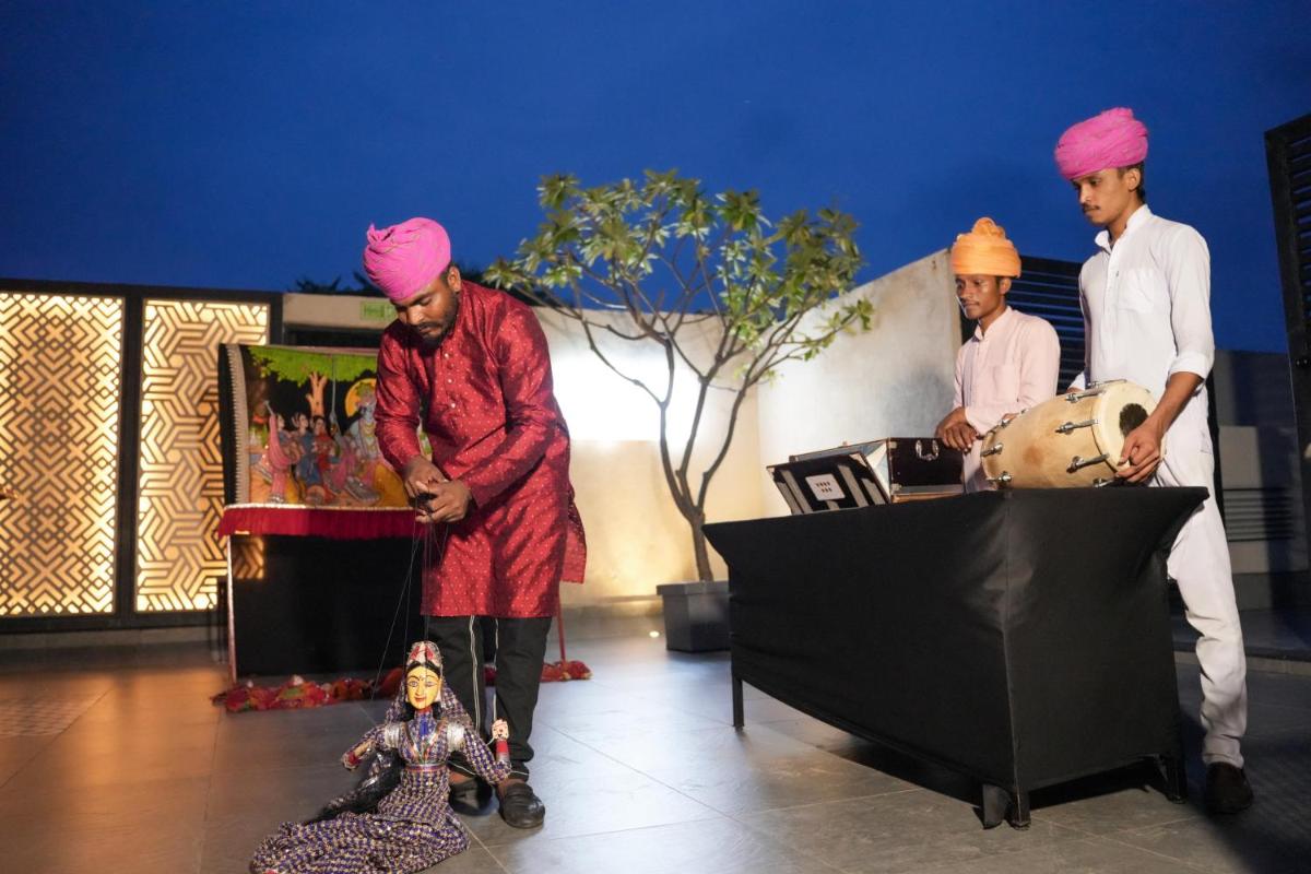 a group of men with pink turbans playing drums at DoubleTree By Hilton Jaipur Amer in Jaipur
