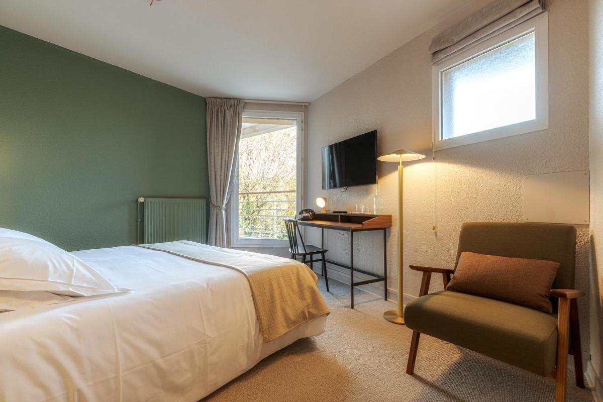 Un ou plusieurs lits dans un hébergement de l'établissement La Maison OBONO Hôtel & Spa