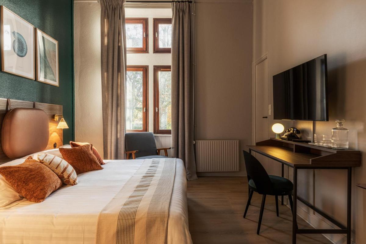 Un ou plusieurs lits dans un hébergement de l'établissement La Maison OBONO Hôtel & Spa