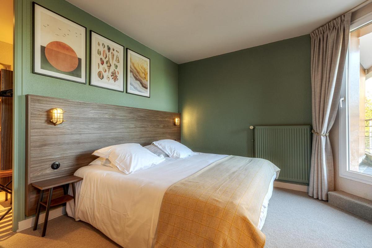 Un ou plusieurs lits dans un hébergement de l'établissement La Maison OBONO Hôtel & Spa
