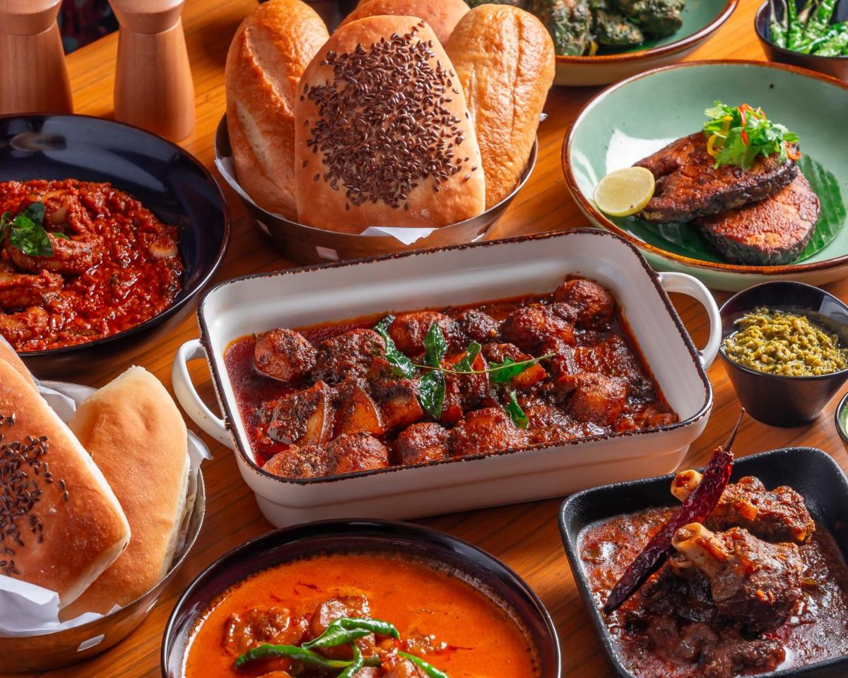 a table topped with lots of different dishes of food at Hyatt Pune in Pune