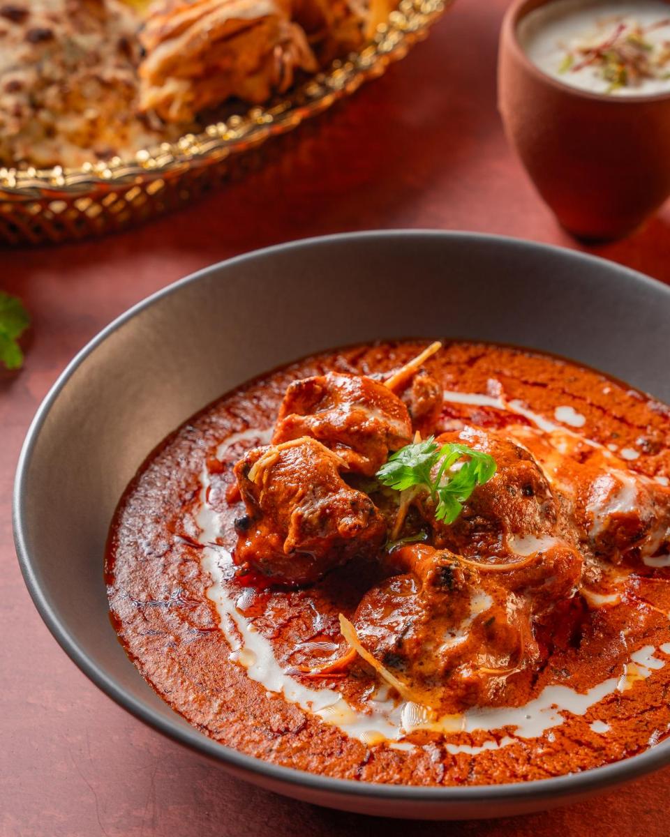 a bowl of food with meatballs and sauce at Hyatt Pune in Pune
