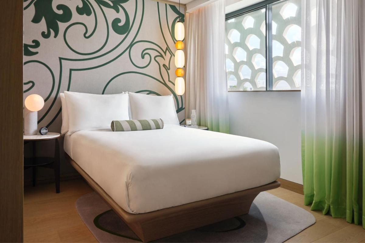 Uma cama ou camas num quarto em W Residences Algarve