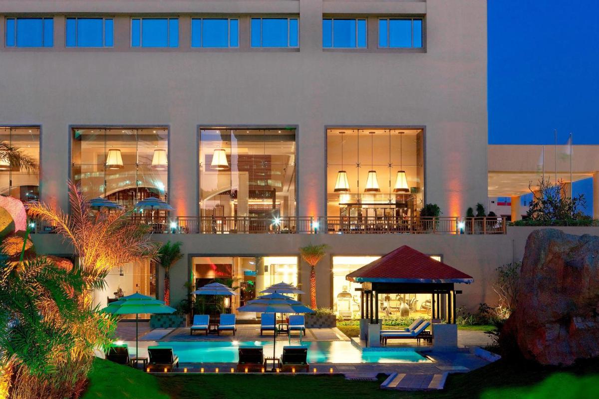 a building with a gazebo in front of it at The Westin Hyderabad Mindspace in Hyderabad